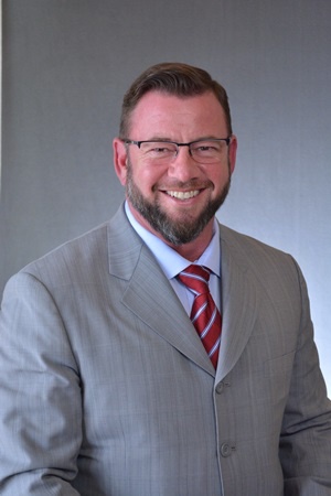 Professional headshot of Patrick J. Kenney